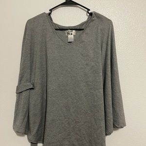 Grey poncho by the brand paraella. Size medium